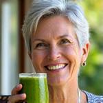 Sarah L. holding a smoothie with Veridian Vitality Greens.